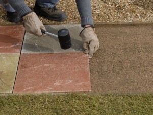 can you lay paving slabs on sand