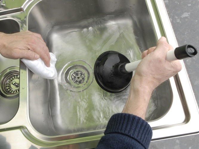 unblocking kitchen sink drains