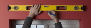 Drawing a guideline for curtain pole with spirit level